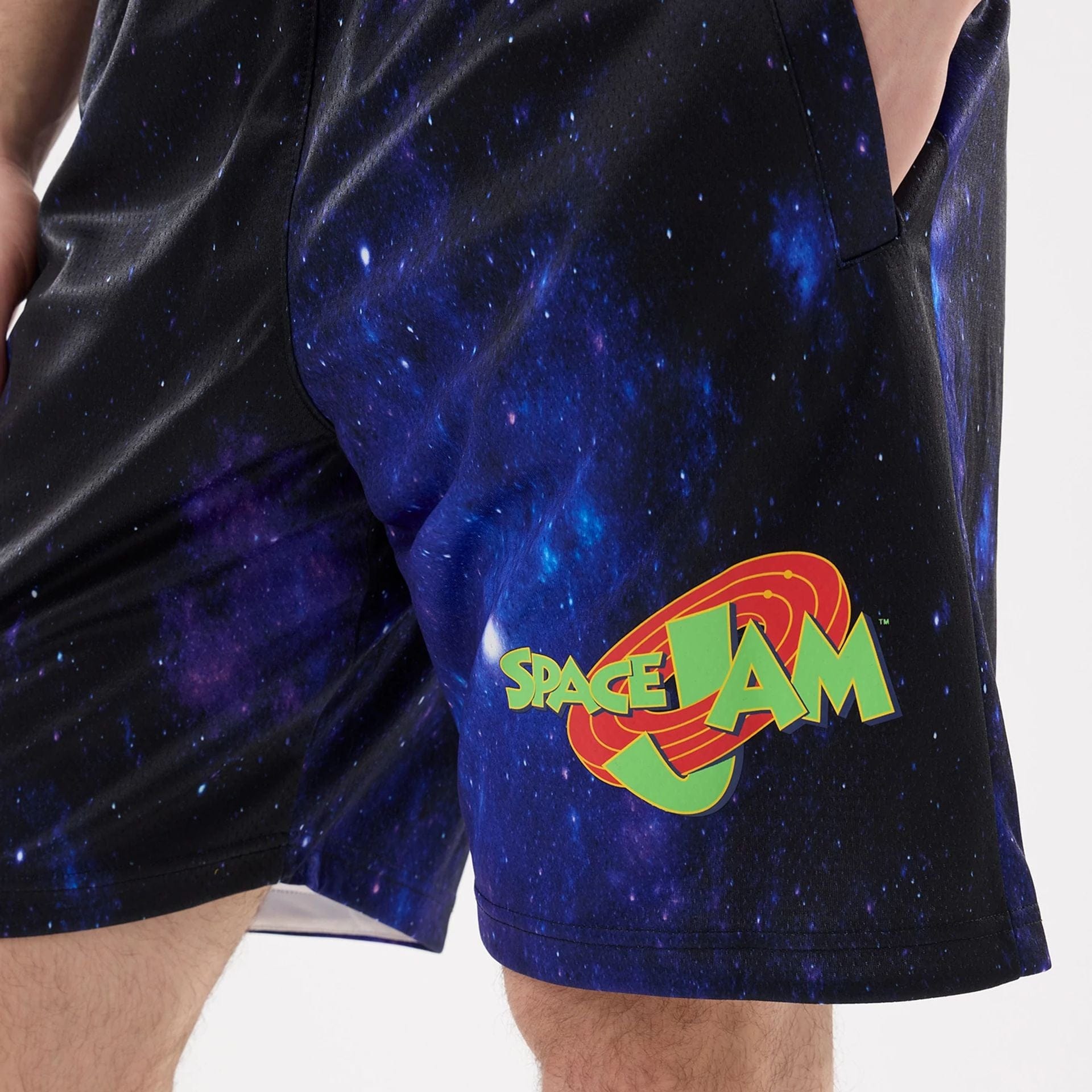The model is wearing this Warner Brothers Space Jam Oversized Shorts in white. 4