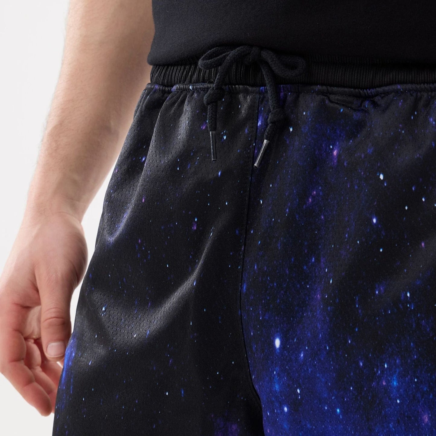 The model is wearing this Warner Brothers Space Jam Oversized Shorts in white. 6