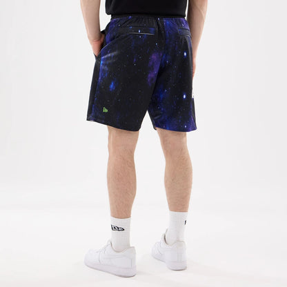 The model is wearing this Warner Brothers Space Jam Oversized Shorts in white. 2