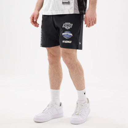 The model is wearing this NHL Match LA Kings Oversized Shorts in black. 1