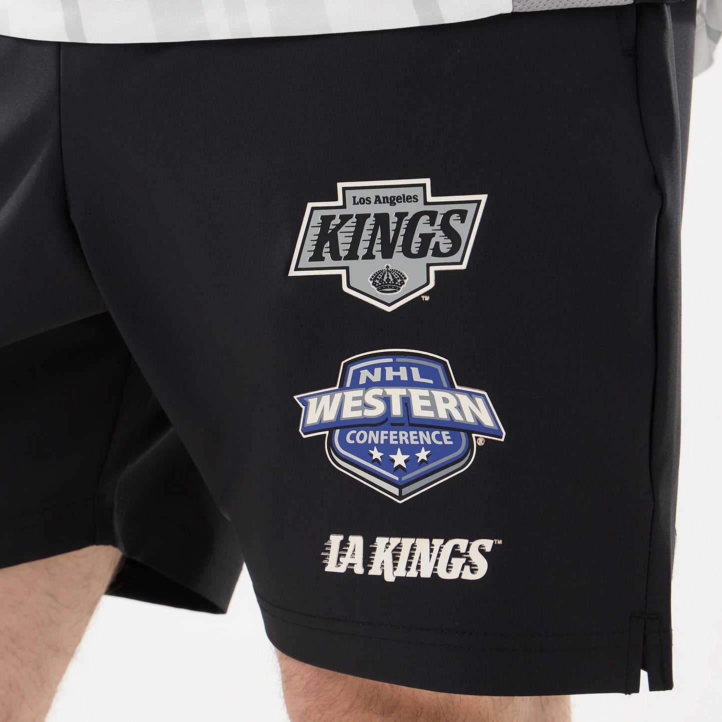 The model is wearing this NHL Match LA Kings Oversized Shorts in black. 3