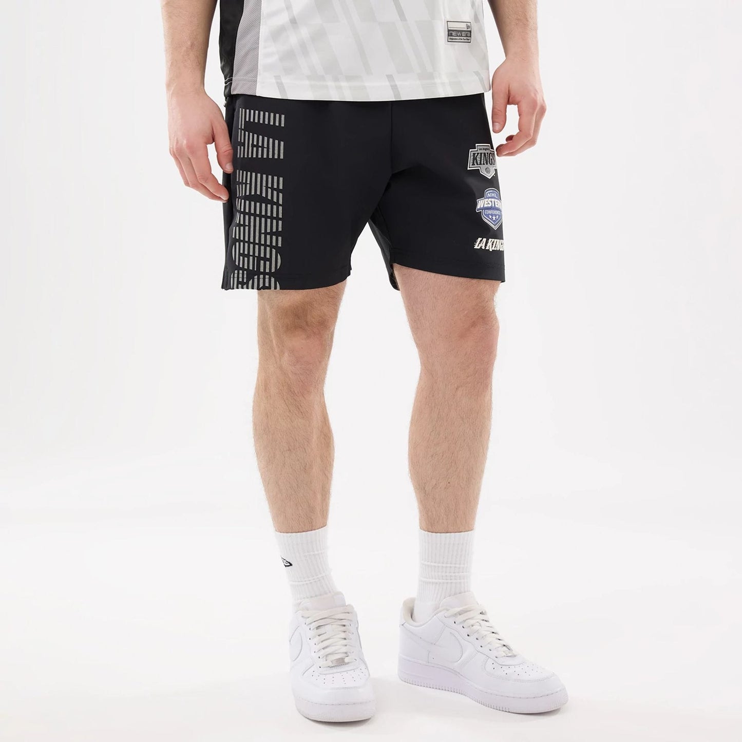 The model is wearing this NHL Match LA Kings Oversized Shorts in black. 5