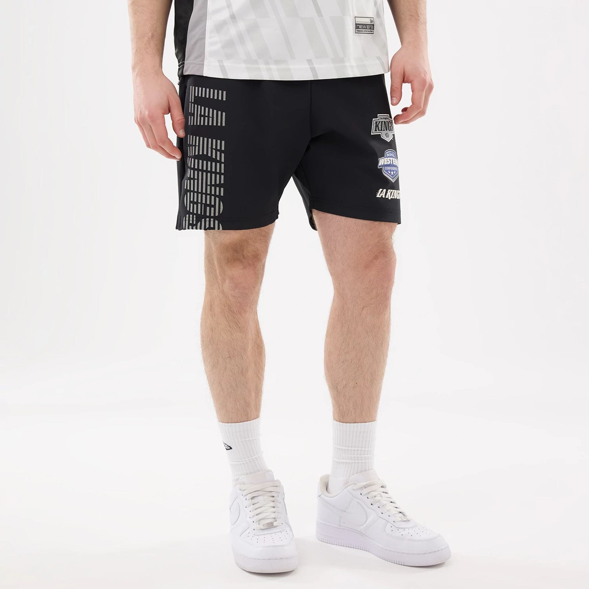 The model is wearing this NHL Match LA Kings Oversized Shorts in black. 5