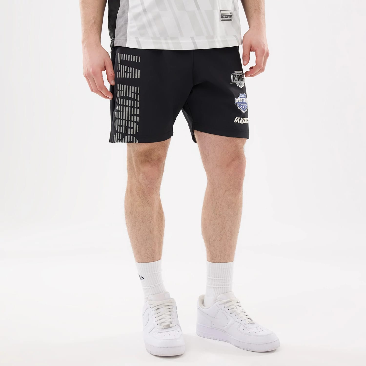 The model is wearing this NHL Match LA Kings Oversized Shorts in black. 5