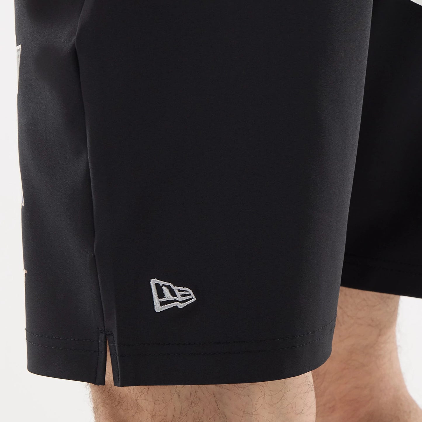 The model is wearing this NHL Match LA Kings Oversized Shorts in black. 4
