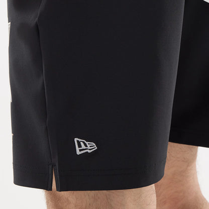 The model is wearing this NHL Match LA Kings Oversized Shorts in black. 4