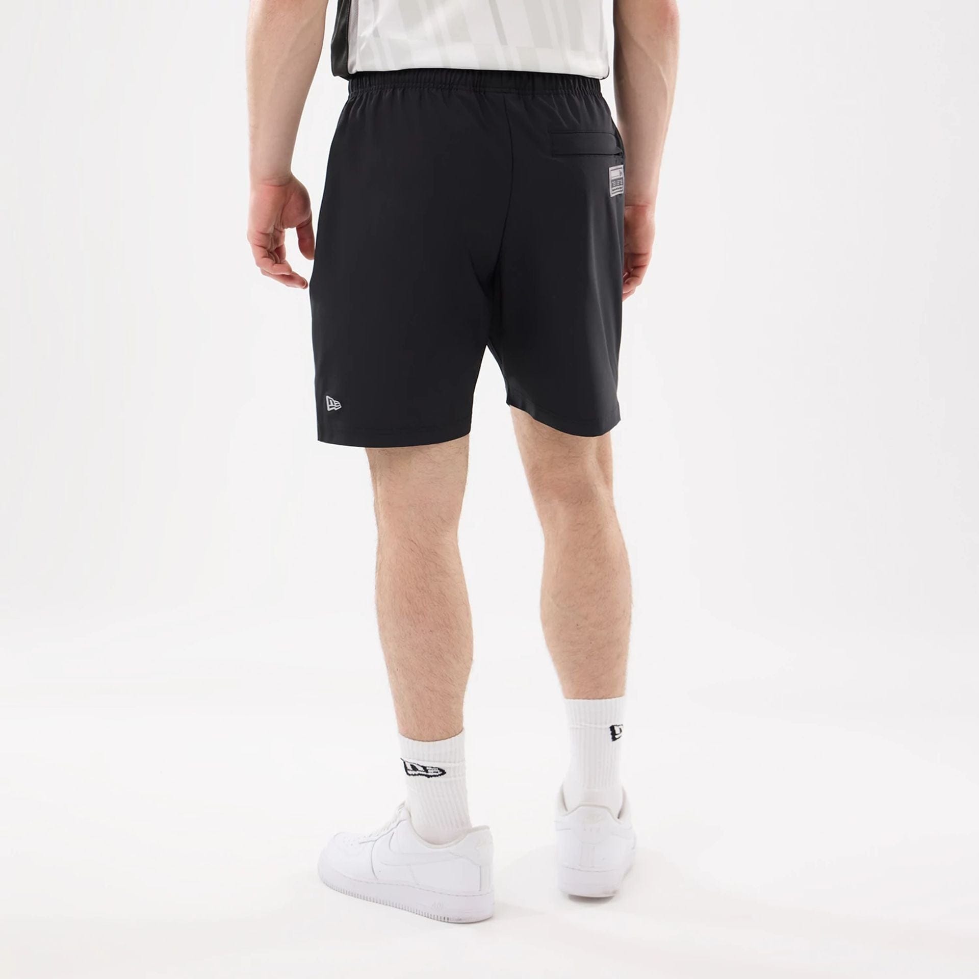 The model is wearing this NHL Match LA Kings Oversized Shorts in black. 2