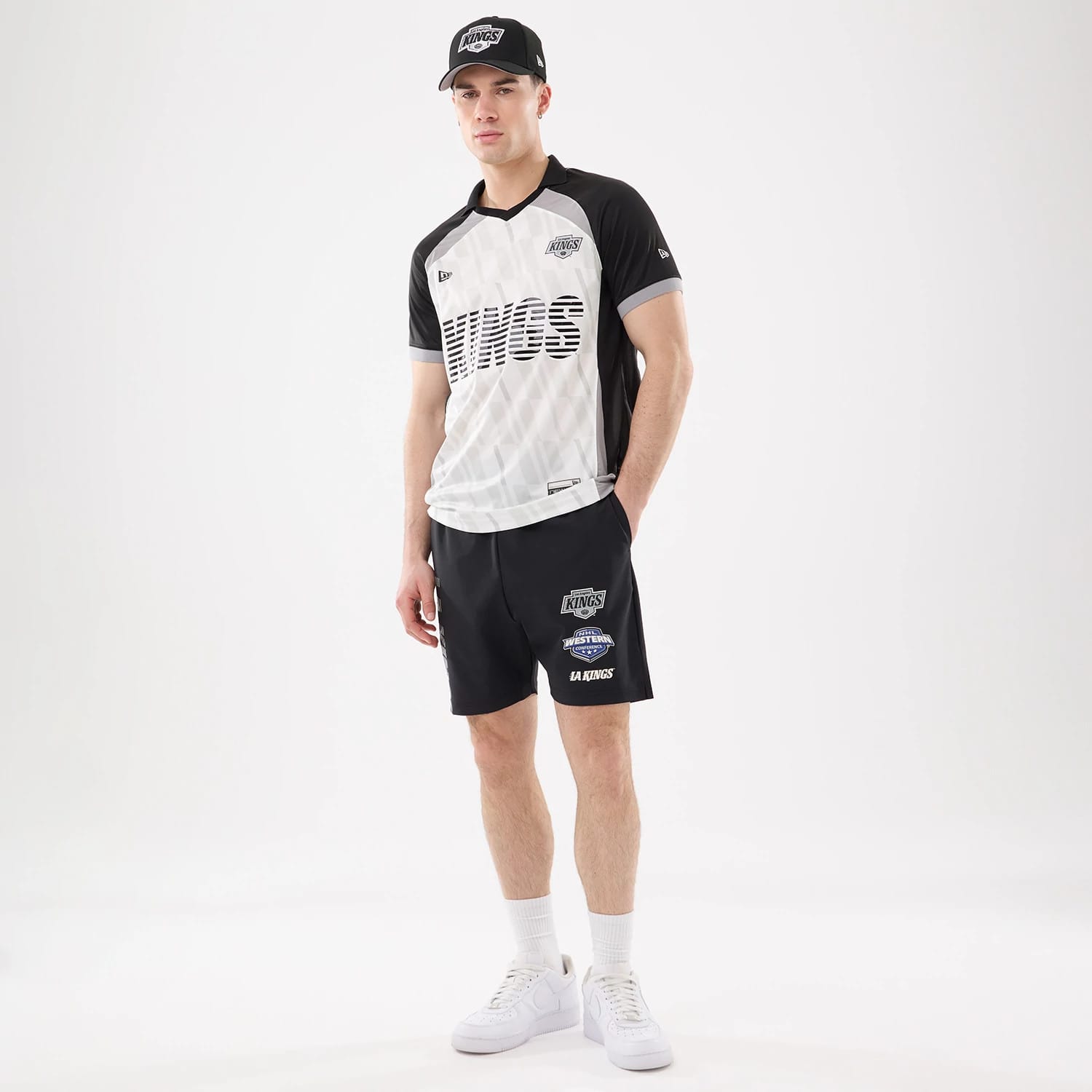 The model is wearing this NHL Match LA Kings Oversized Shorts in black. 8