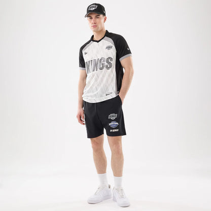 The model is wearing this NHL Match LA Kings Oversized Shorts in black. 8