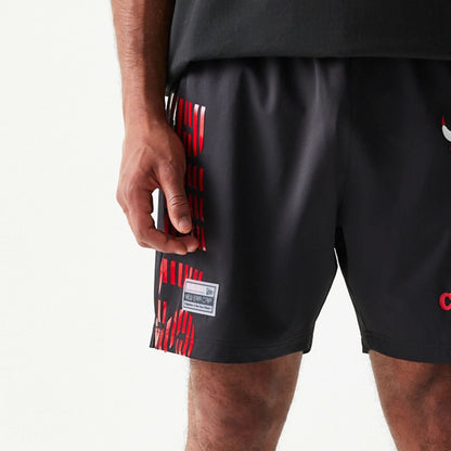 The model is wearing this NBA Match Chicago Bulls Oversized Shorts in black. 4
