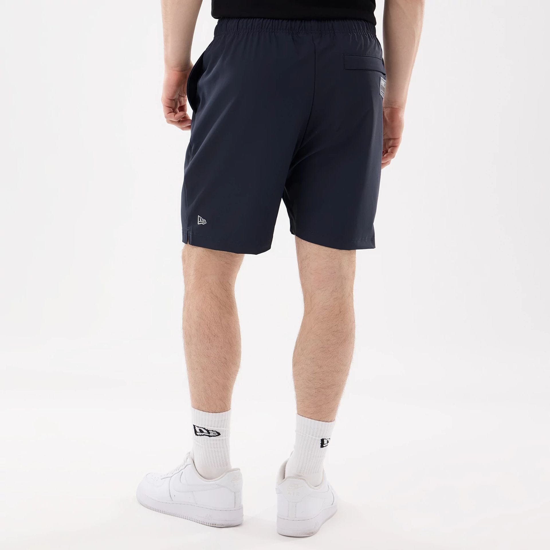 The model is wearing this MLB Match New York Yankees Oversized Shorts in navy. 2