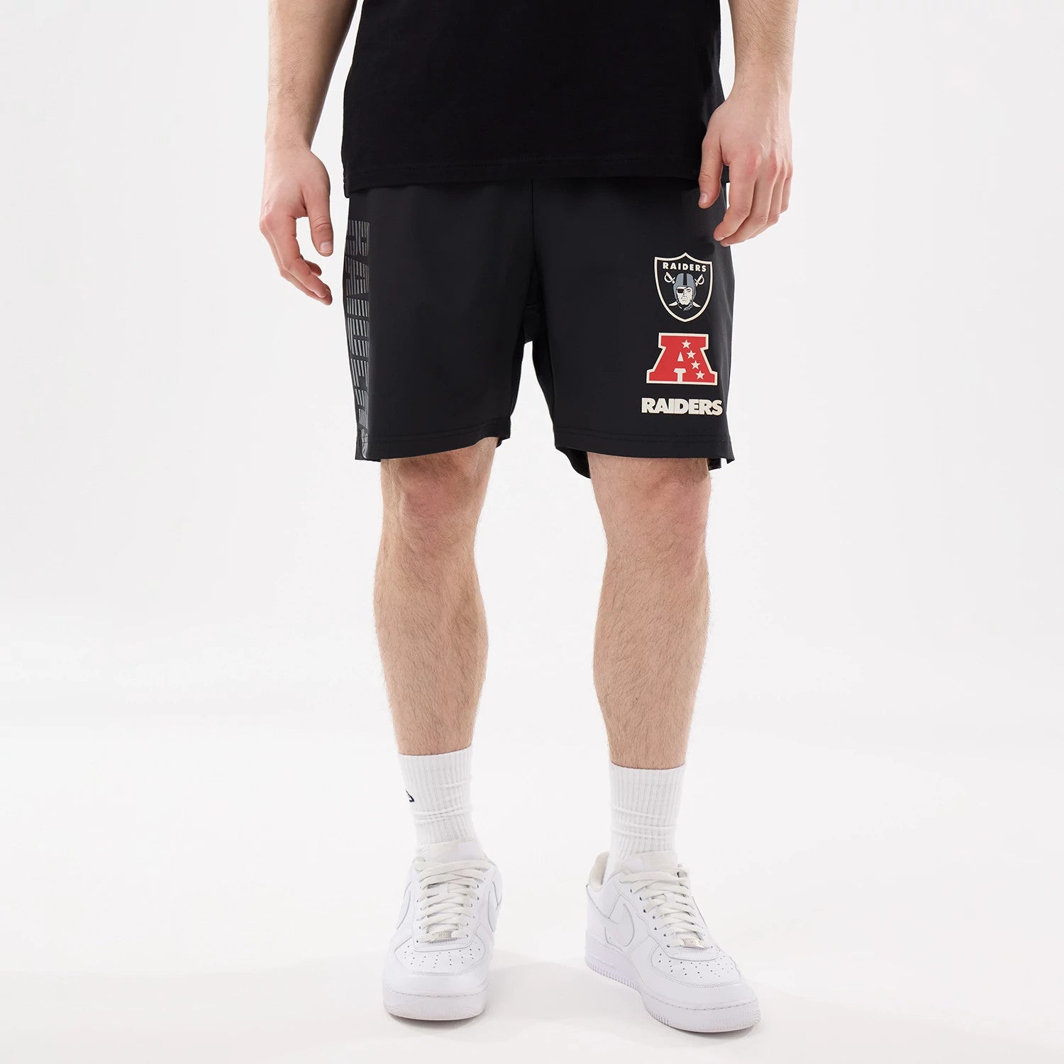 The model is wearing this NFL Match Las Vegas Raiders Oversized Shorts in black. 5