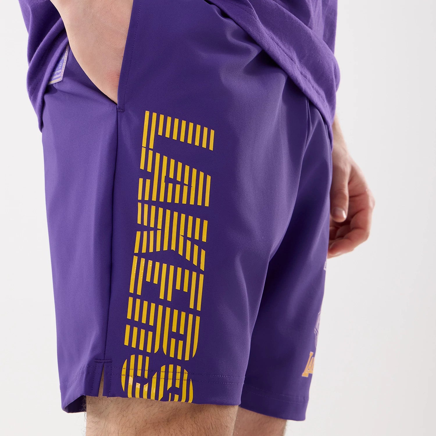 The model is wearing this NBA Match LA Lakers Oversized Shorts in purple. 4