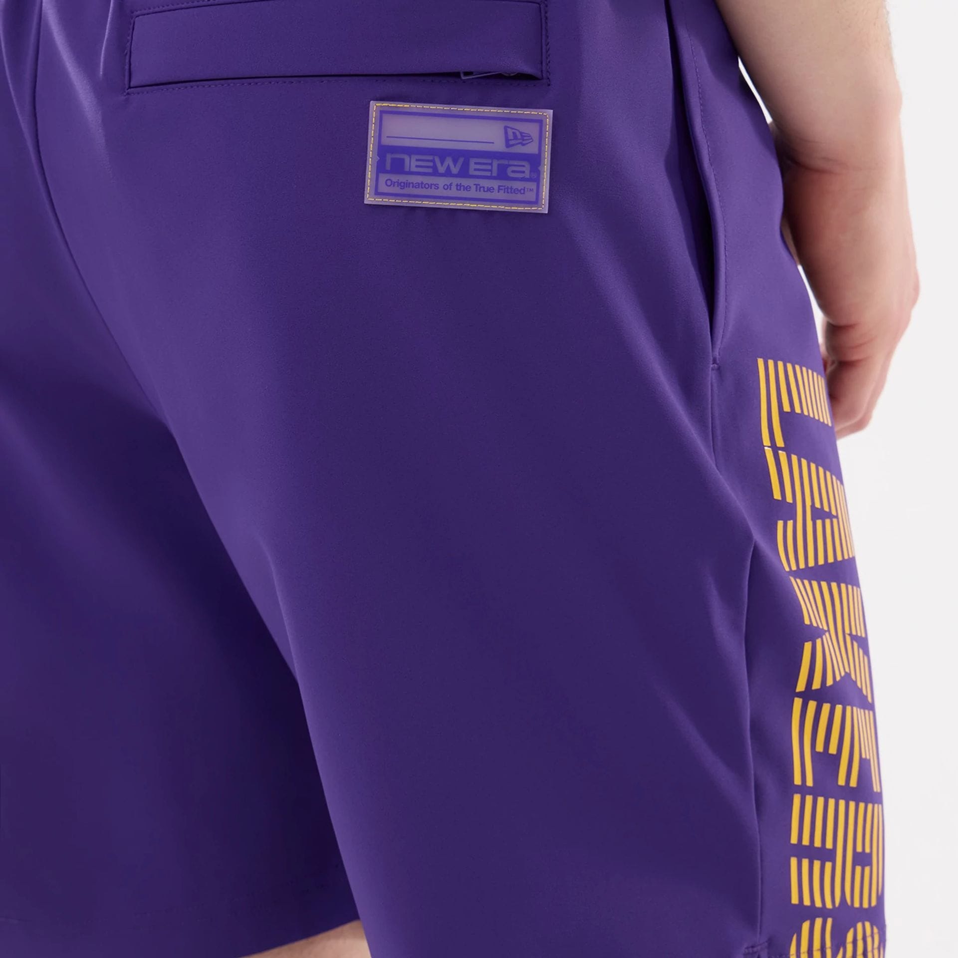 The model is wearing this NBA Match LA Lakers Oversized Shorts in purple. 5