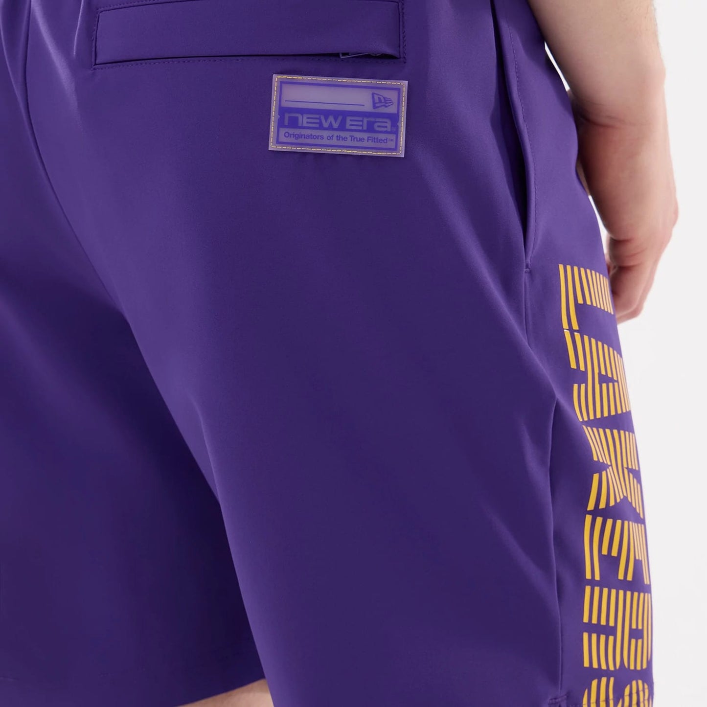 The model is wearing this NBA Match LA Lakers Oversized Shorts in purple. 5