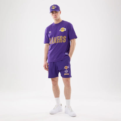 The model is wearing this NBA Match LA Lakers Oversized Shorts in purple. 6