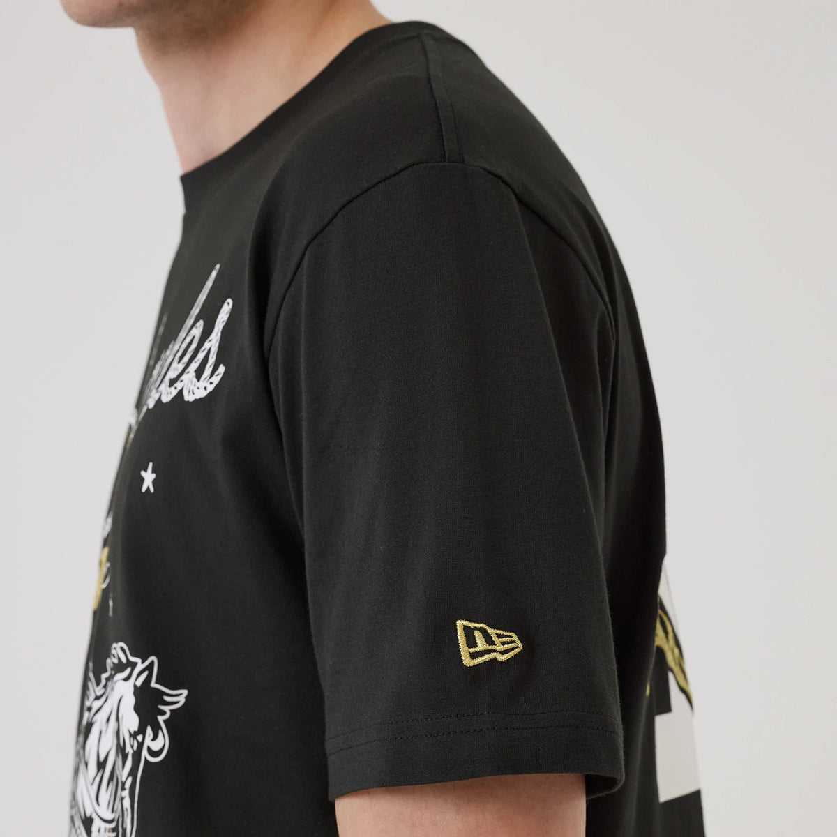 The model is wearing this MLB Cowboy Graphic LA Dodgers T-Shirt in black. 6