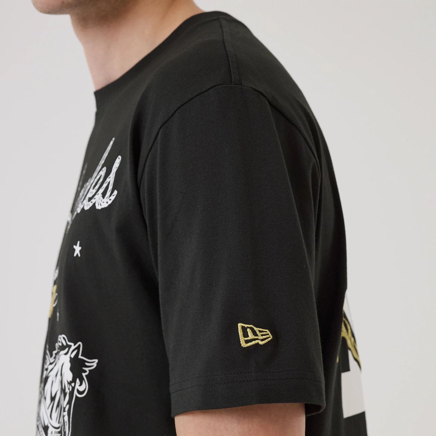 The model is wearing this MLB Cowboy Graphic LA Dodgers T-Shirt in black. 6