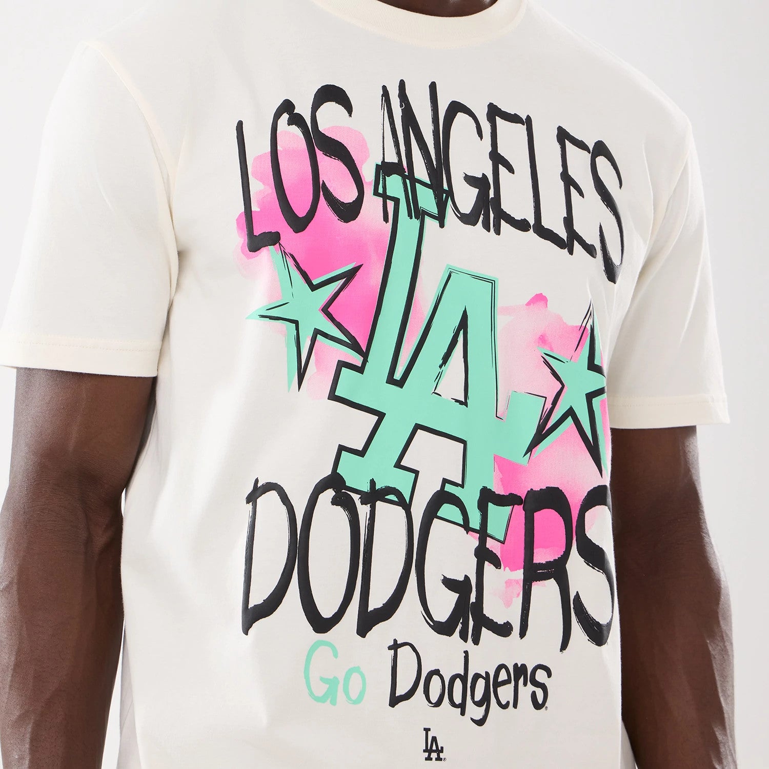 The model is wearing this MLB Street Art Graphic LA Dodgers T-Shirt in light beige. 3