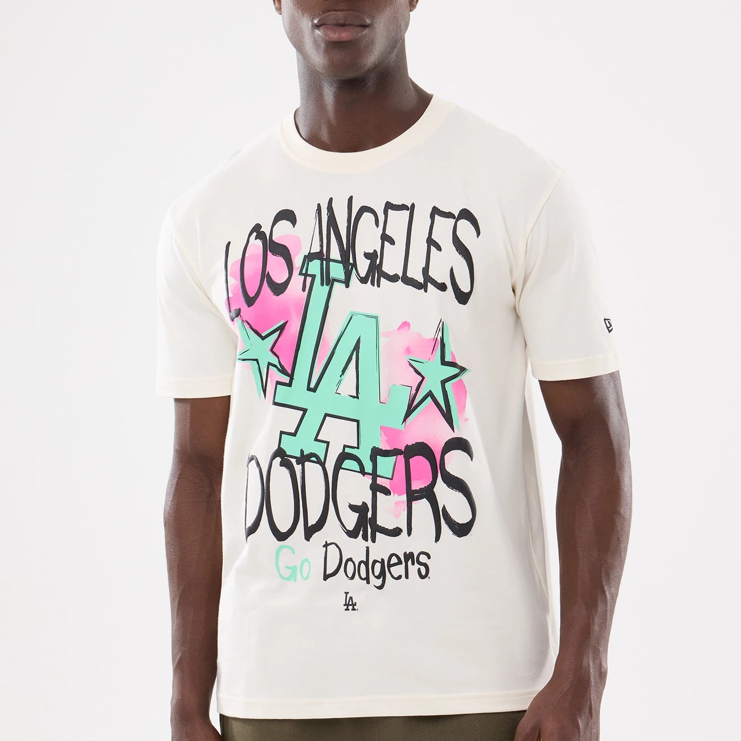 The model is wearing this MLB Street Art Graphic LA Dodgers T-Shirt in light beige. 4