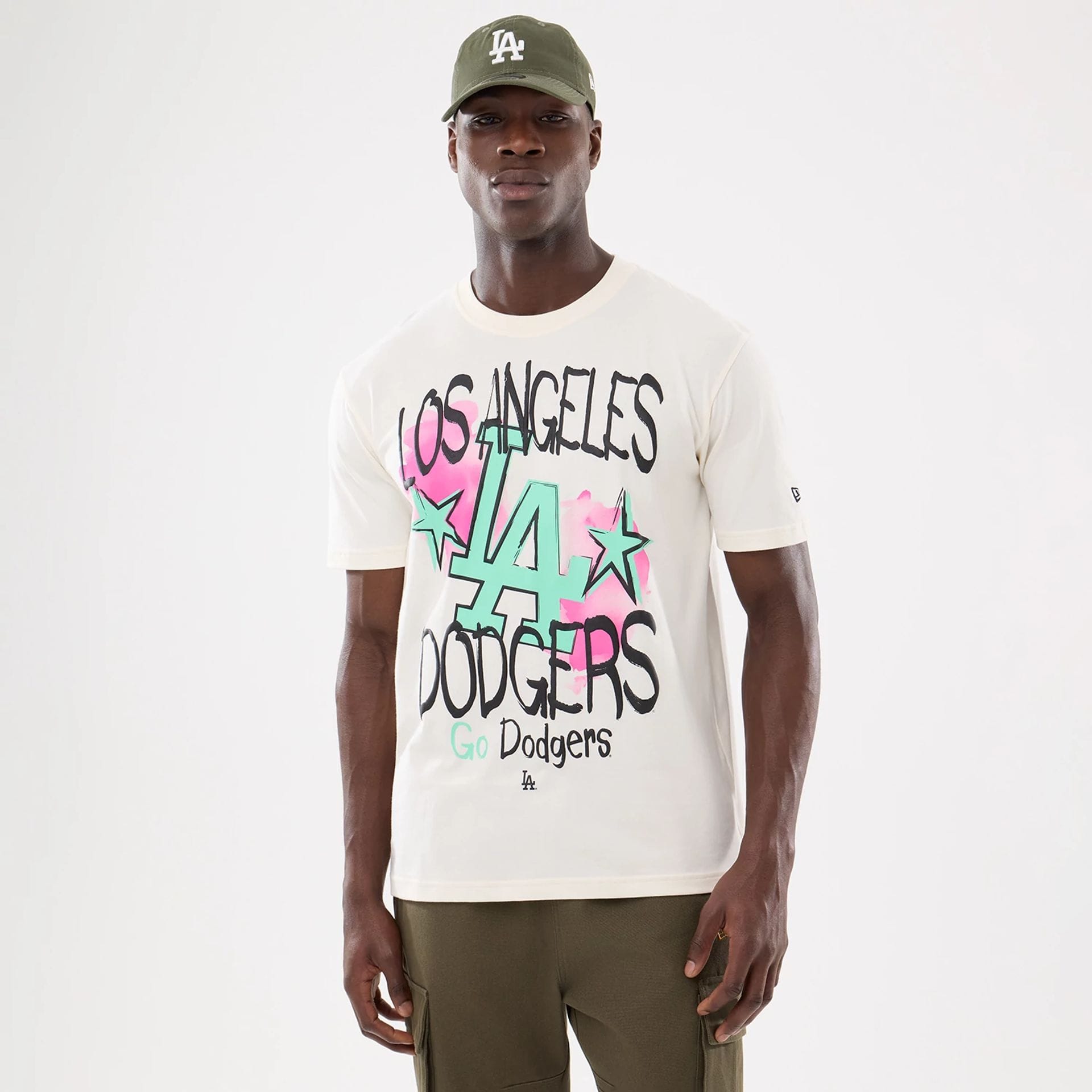 The model is wearing this MLB Street Art Graphic LA Dodgers T-Shirt in light beige. 1