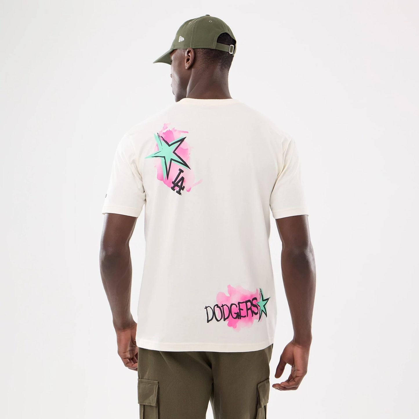 The model is wearing this MLB Street Art Graphic LA Dodgers T-Shirt in light beige. 2