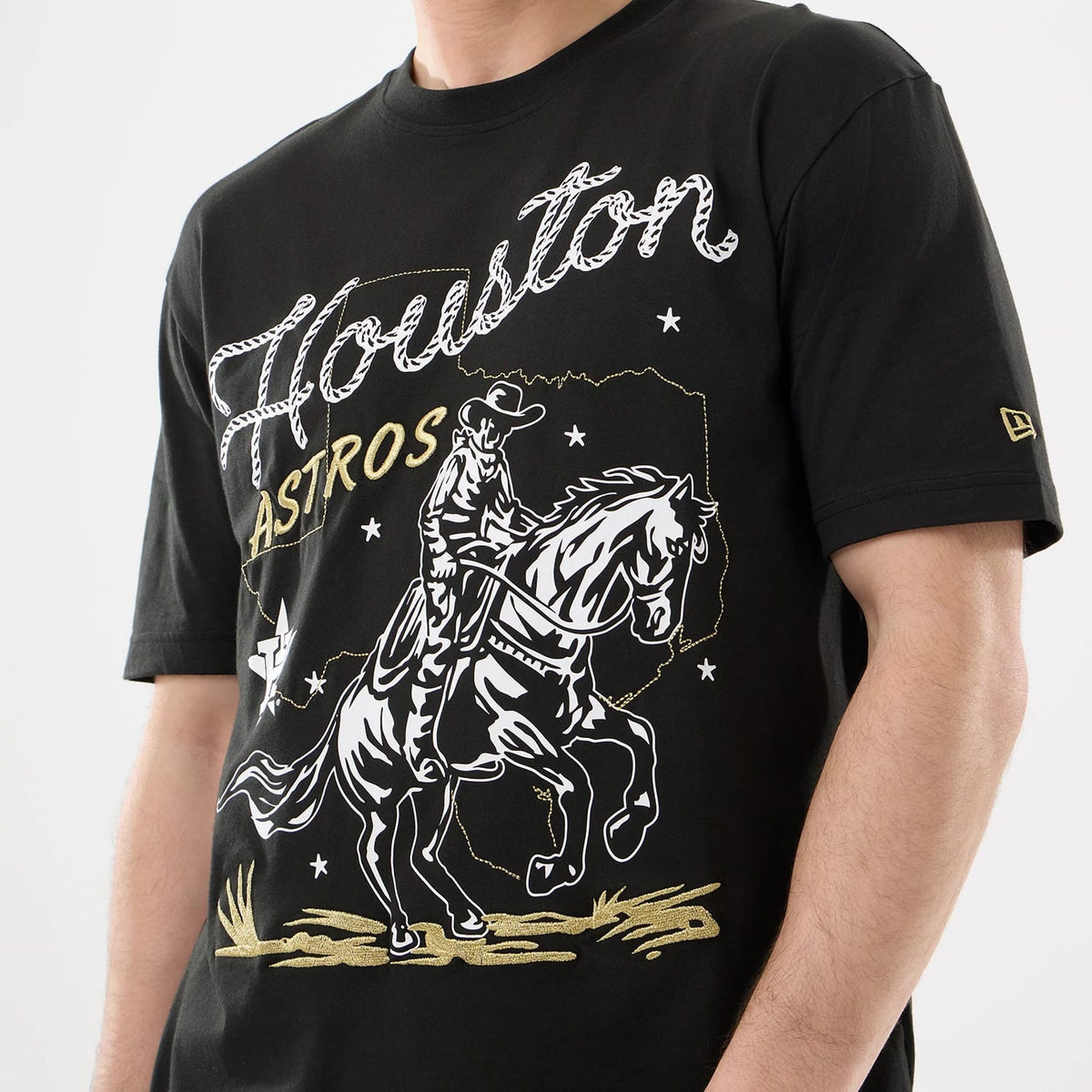 The model is wearing this MLB Cowboy Graphic Houston Astros T-Shirt in black. 3