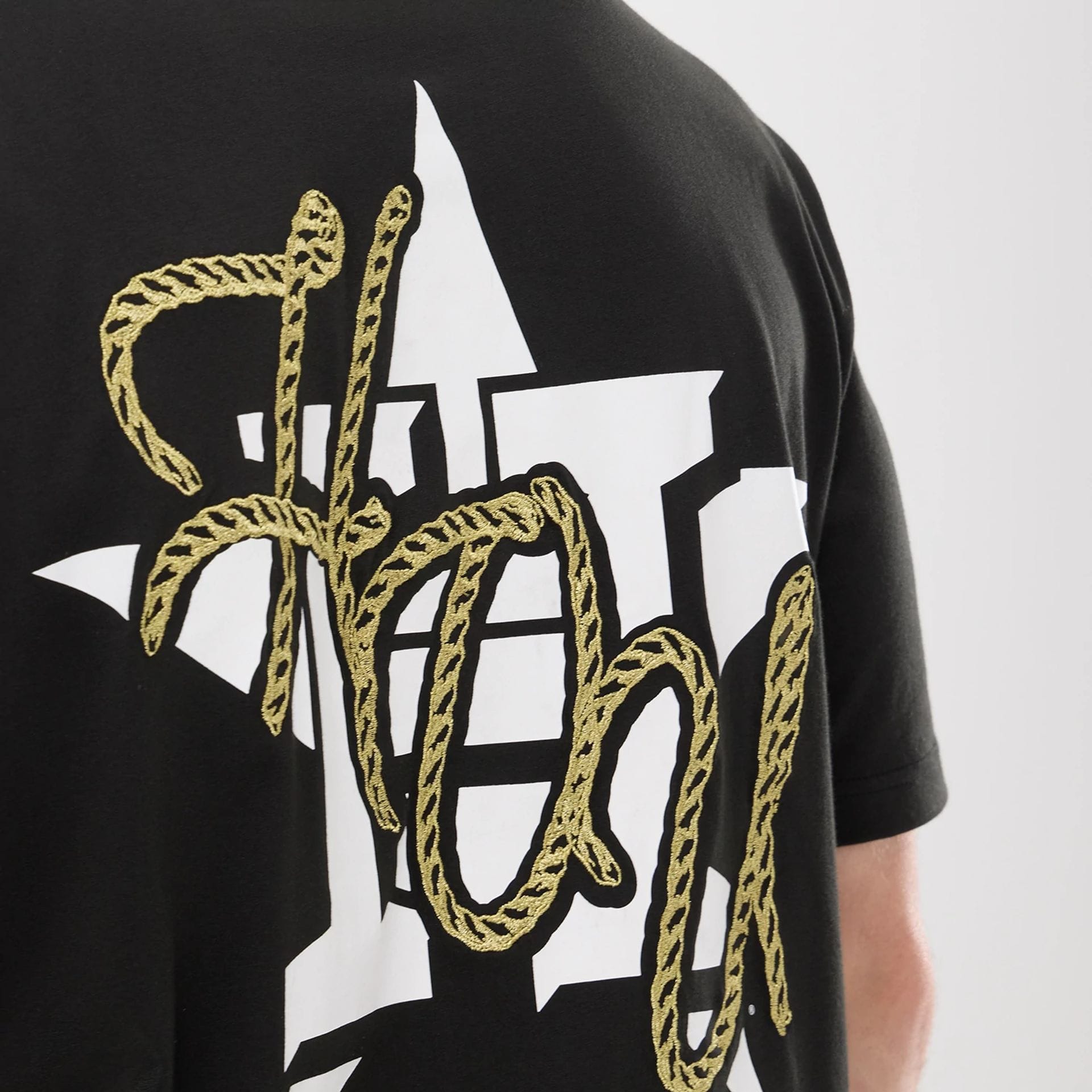 The model is wearing this MLB Cowboy Graphic Houston Astros T-Shirt in black. 6