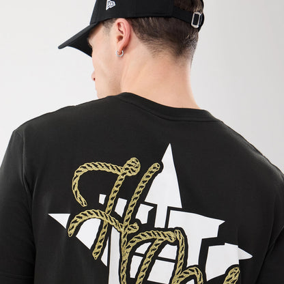 The model is wearing this MLB Cowboy Graphic Houston Astros T-Shirt in black. 7