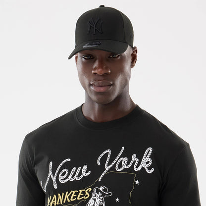 The model is wearing this MLB Cowboy Graphic New York Yankees T-Shirt in black. 6