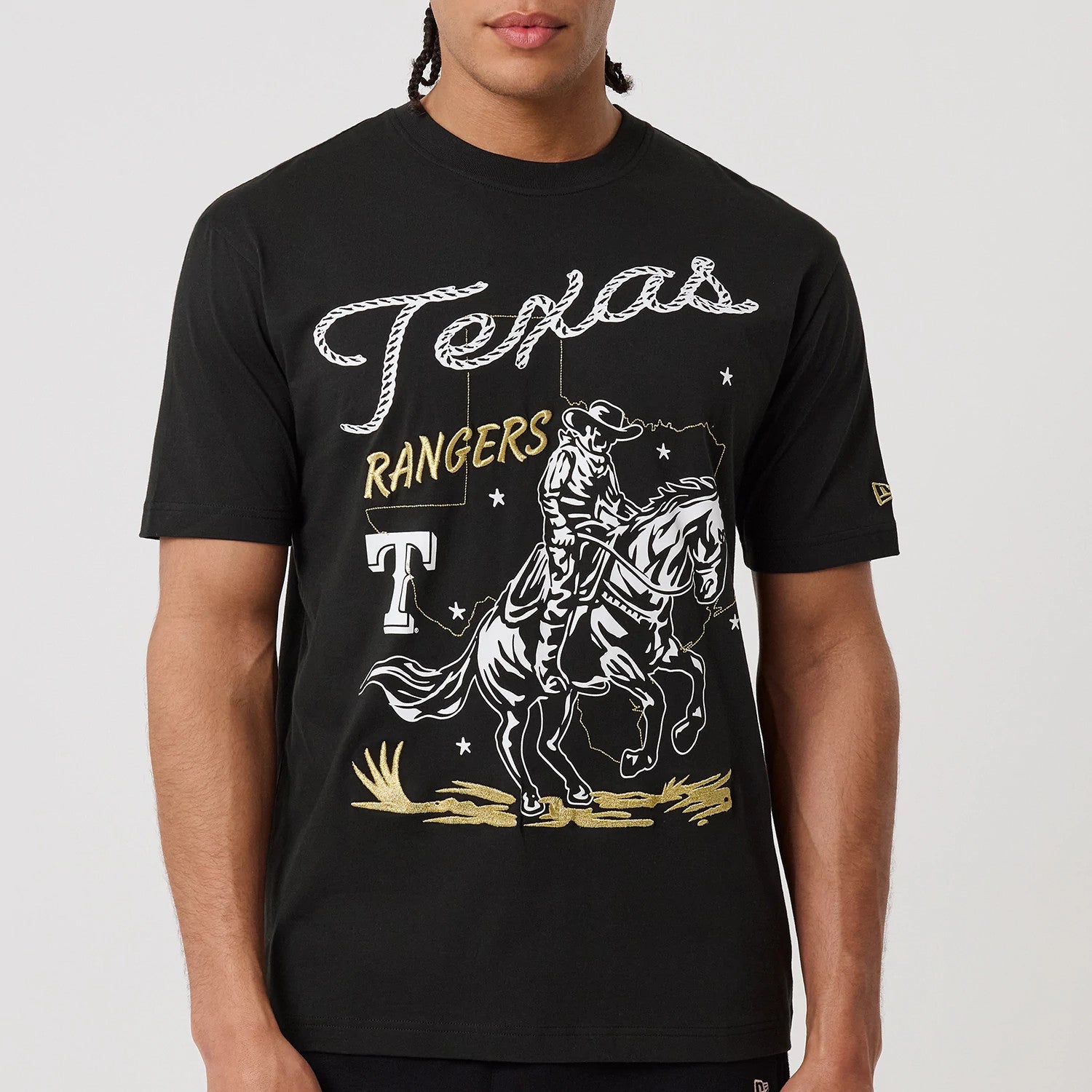 The model is wearing this MLB Cowboy Graphic Texas Rangers T-Shirt in black. 5