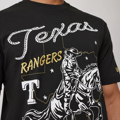 The model is wearing this MLB Cowboy Graphic Texas Rangers T-Shirt in black. 3