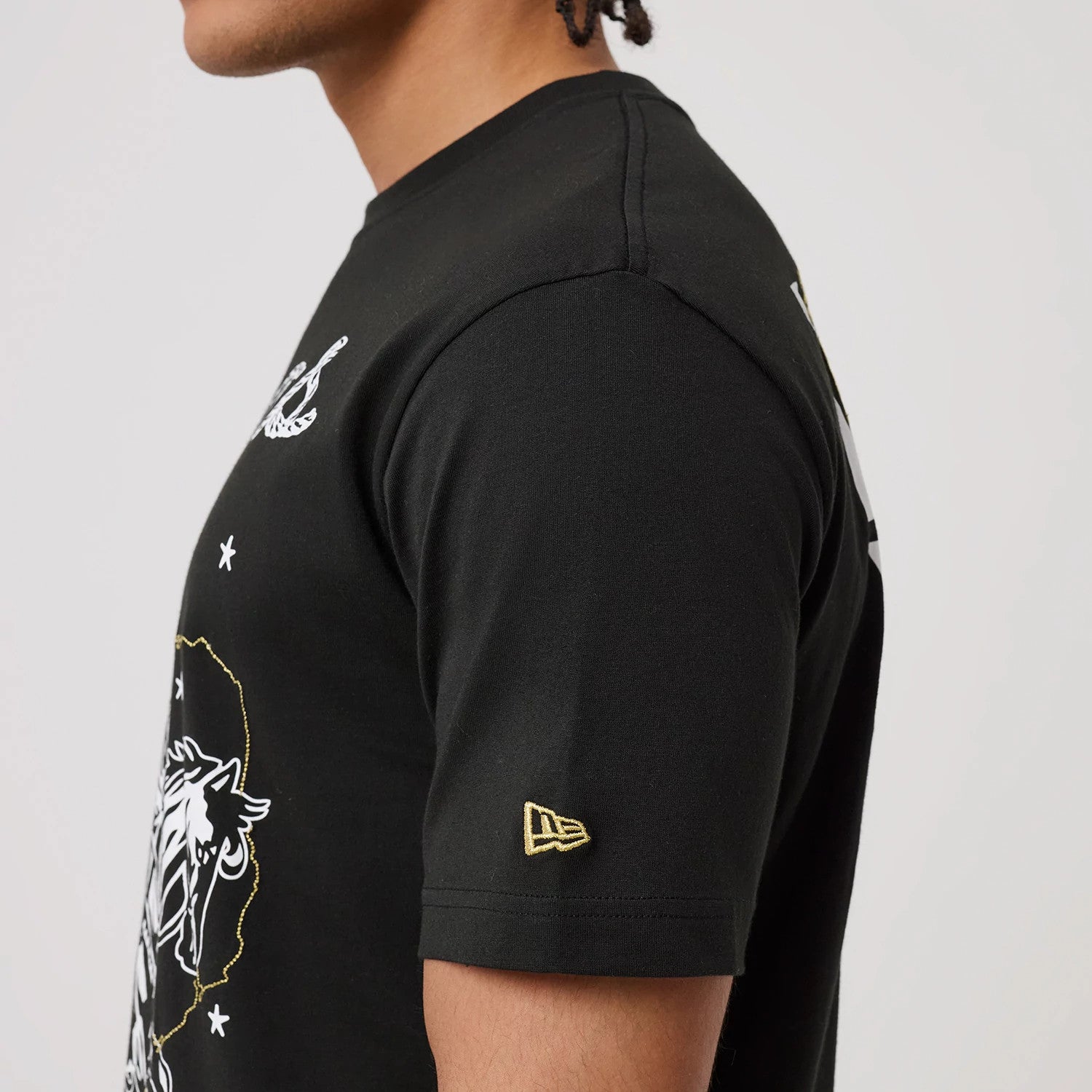The model is wearing this MLB Cowboy Graphic Texas Rangers T-Shirt in black. 6