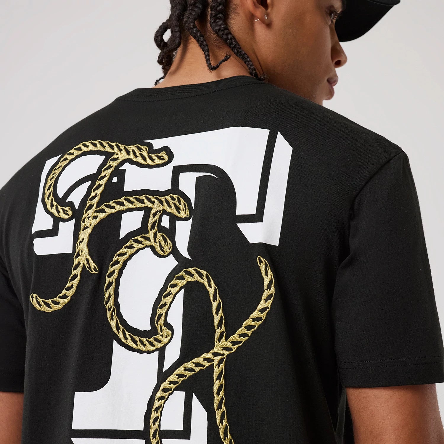 The model is wearing this MLB Cowboy Graphic Texas Rangers T-Shirt in black. 4
