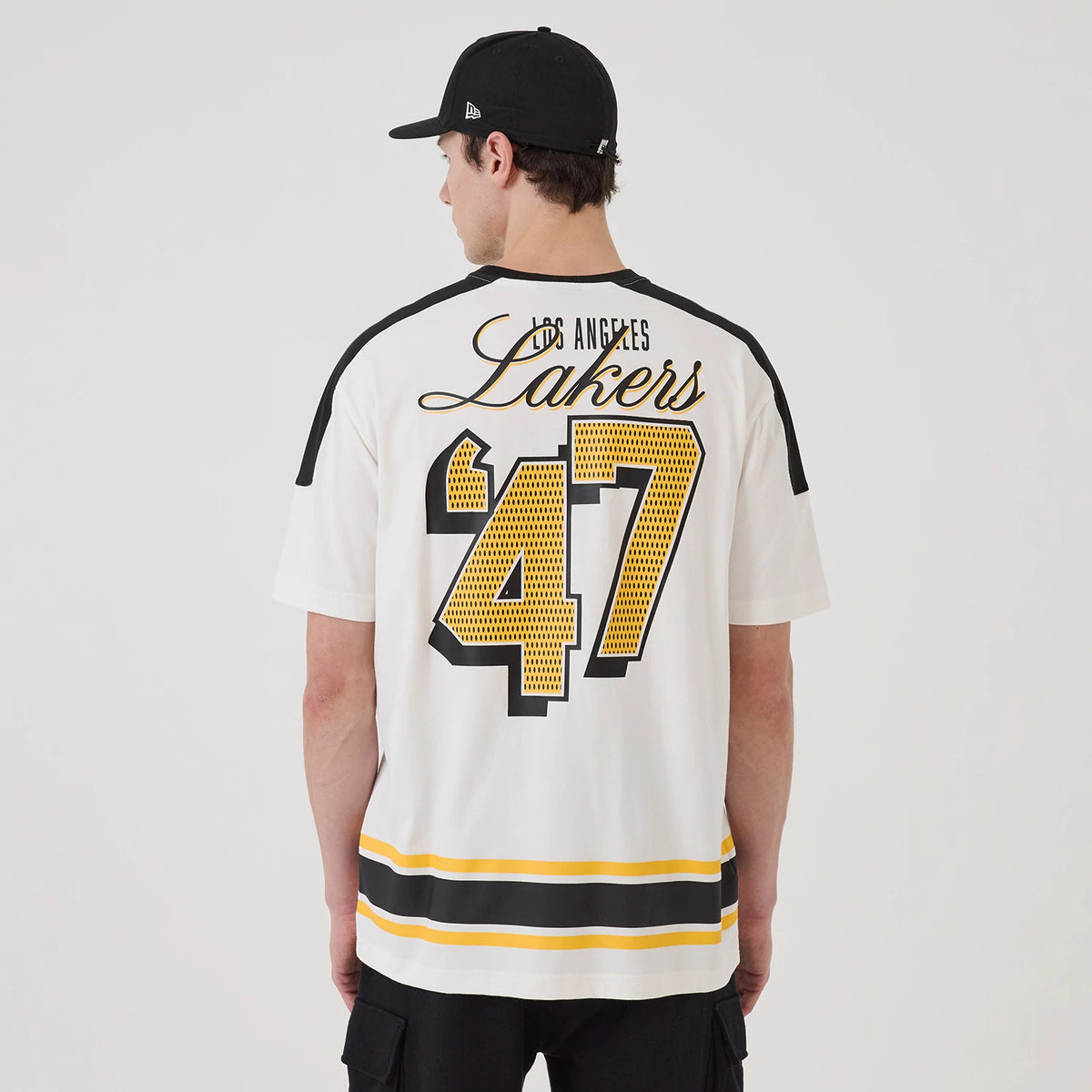 New Era LA Lakers NBA Sport Classic White T-Shirt, back view showing large black and yellow '47' graphic and Los Angeles Lakers script lettering, black panels on the shoulders, and horizontal stripes at the hem.