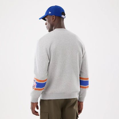 The model is wearing this MLB Sport Classic New York Mets Crew Neck Sweater in grey. 2