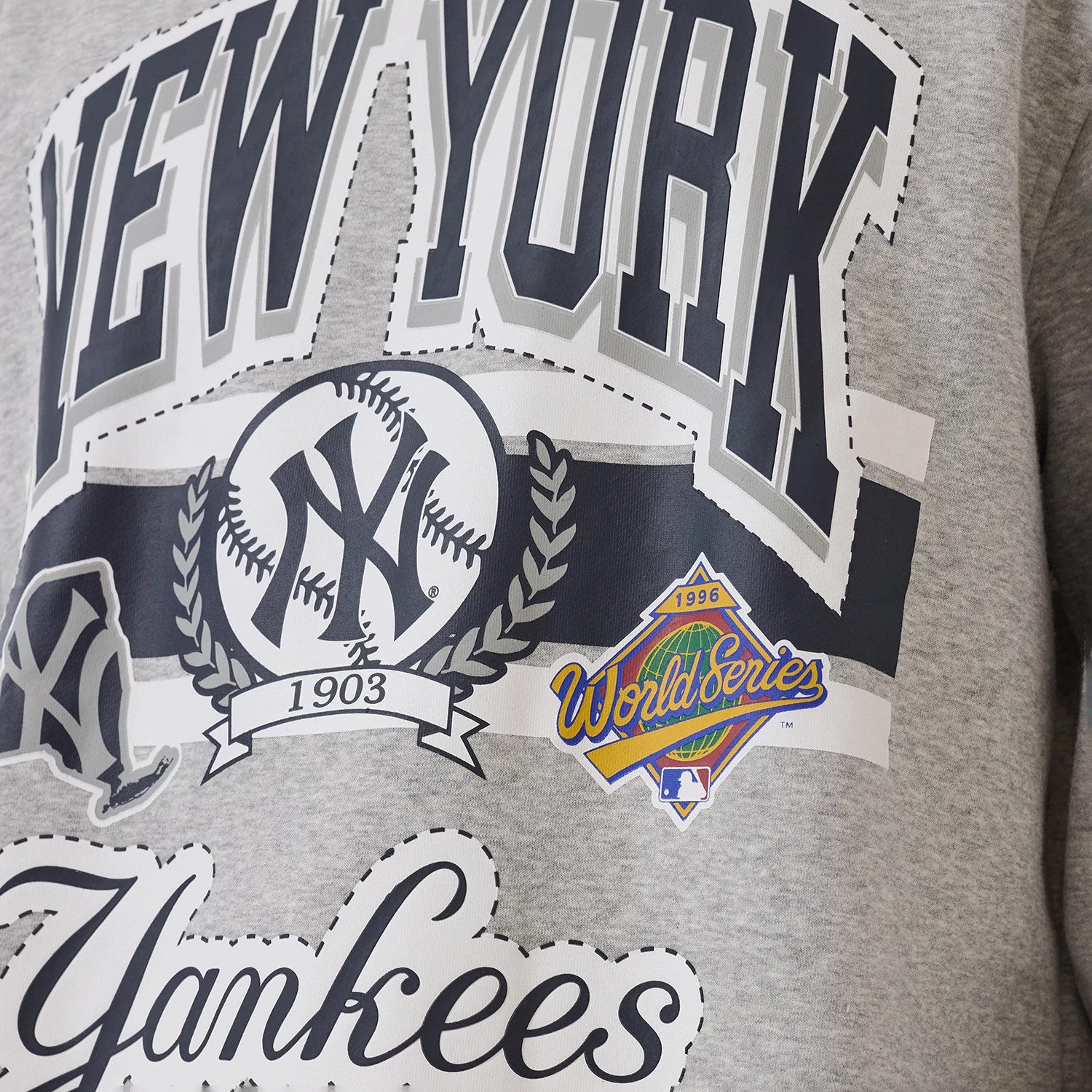 The model is wearing this MLB Sport Classic New York Yankees Crew Neck Sweater in grey. 4