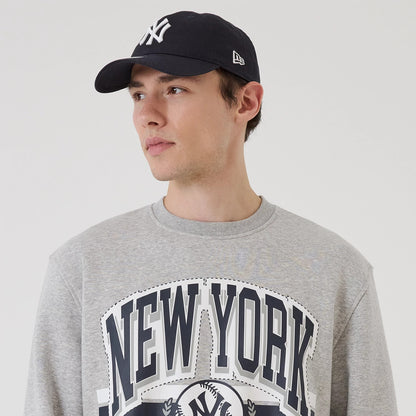 The model is wearing this MLB Sport Classic New York Yankees Crew Neck Sweater in grey. 6