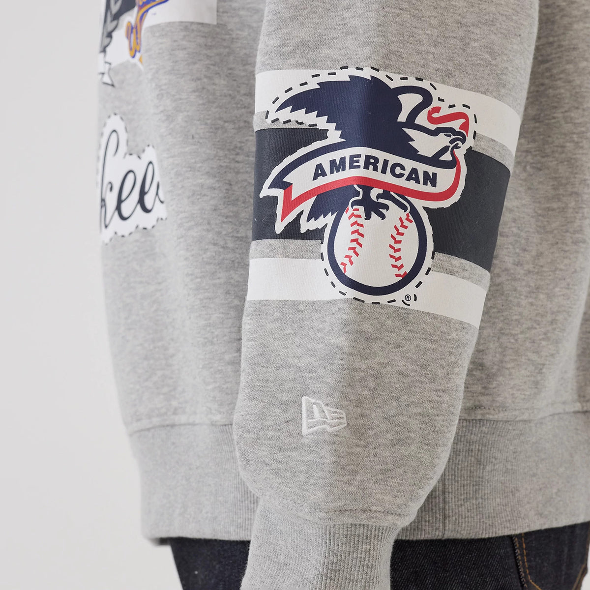 The model is wearing this MLB Sport Classic New York Yankees Crew Neck Sweater in grey. 5