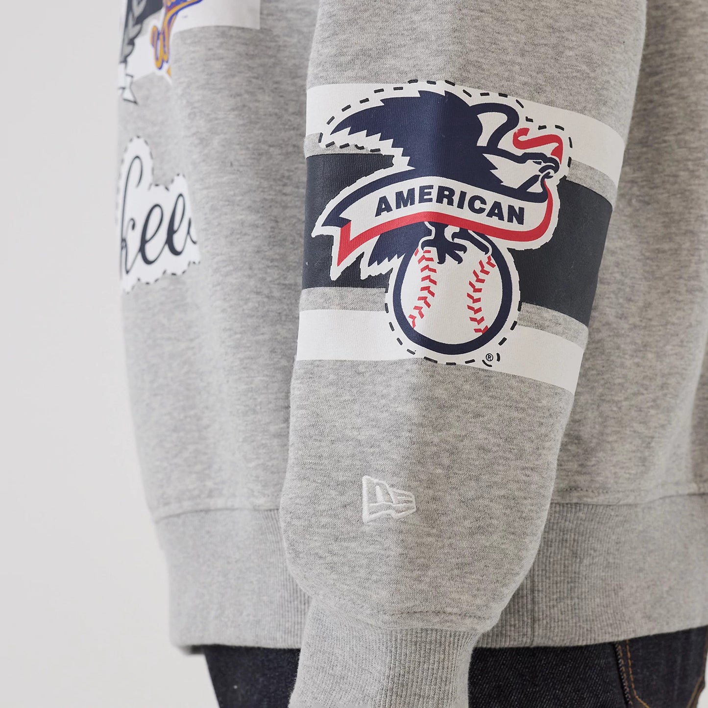 The model is wearing this MLB Sport Classic New York Yankees Crew Neck Sweater in grey. 5