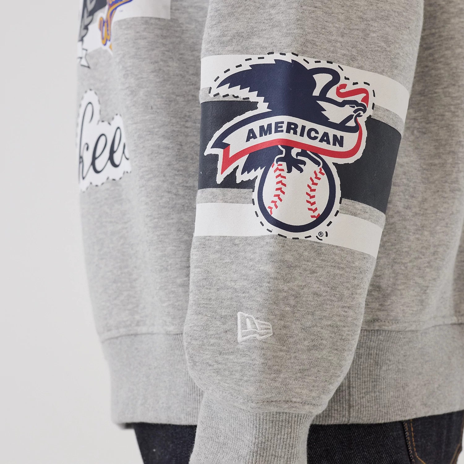 The model is wearing this MLB Sport Classic New York Yankees Crew Neck Sweater in grey. 5