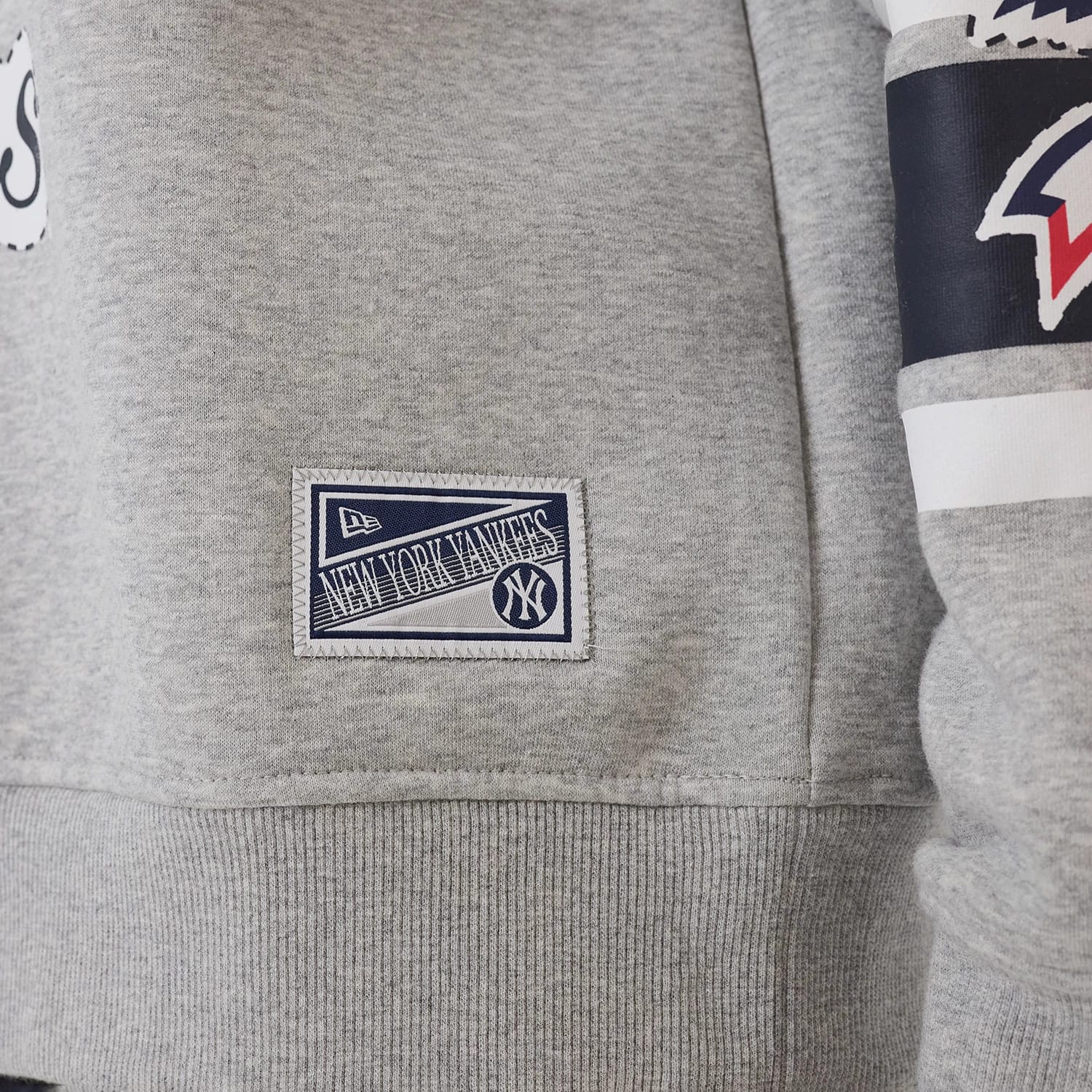 The model is wearing this MLB Sport Classic New York Yankees Crew Neck Sweater in grey. 7