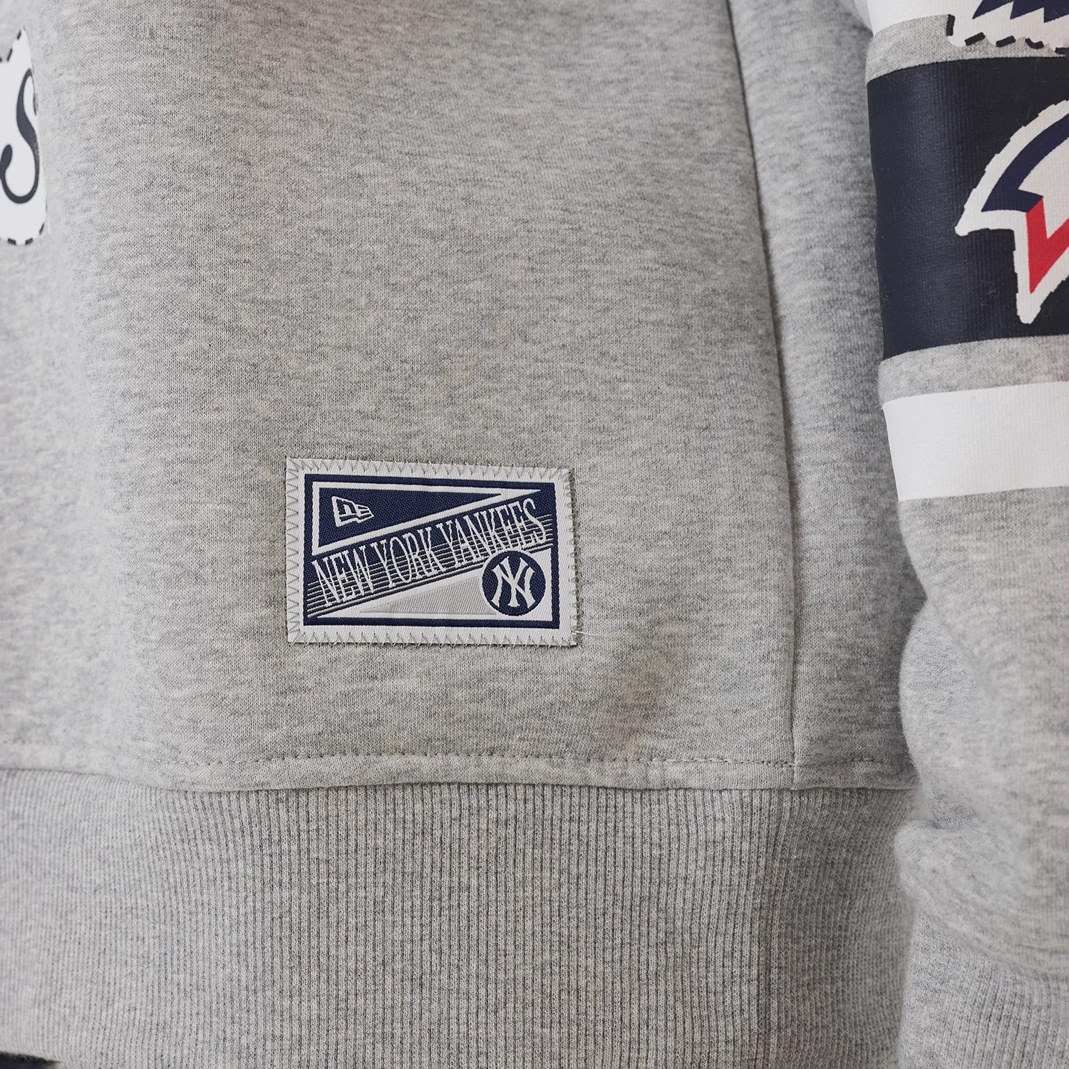 The model is wearing this MLB Sport Classic New York Yankees Crew Neck Sweater in grey. 7
