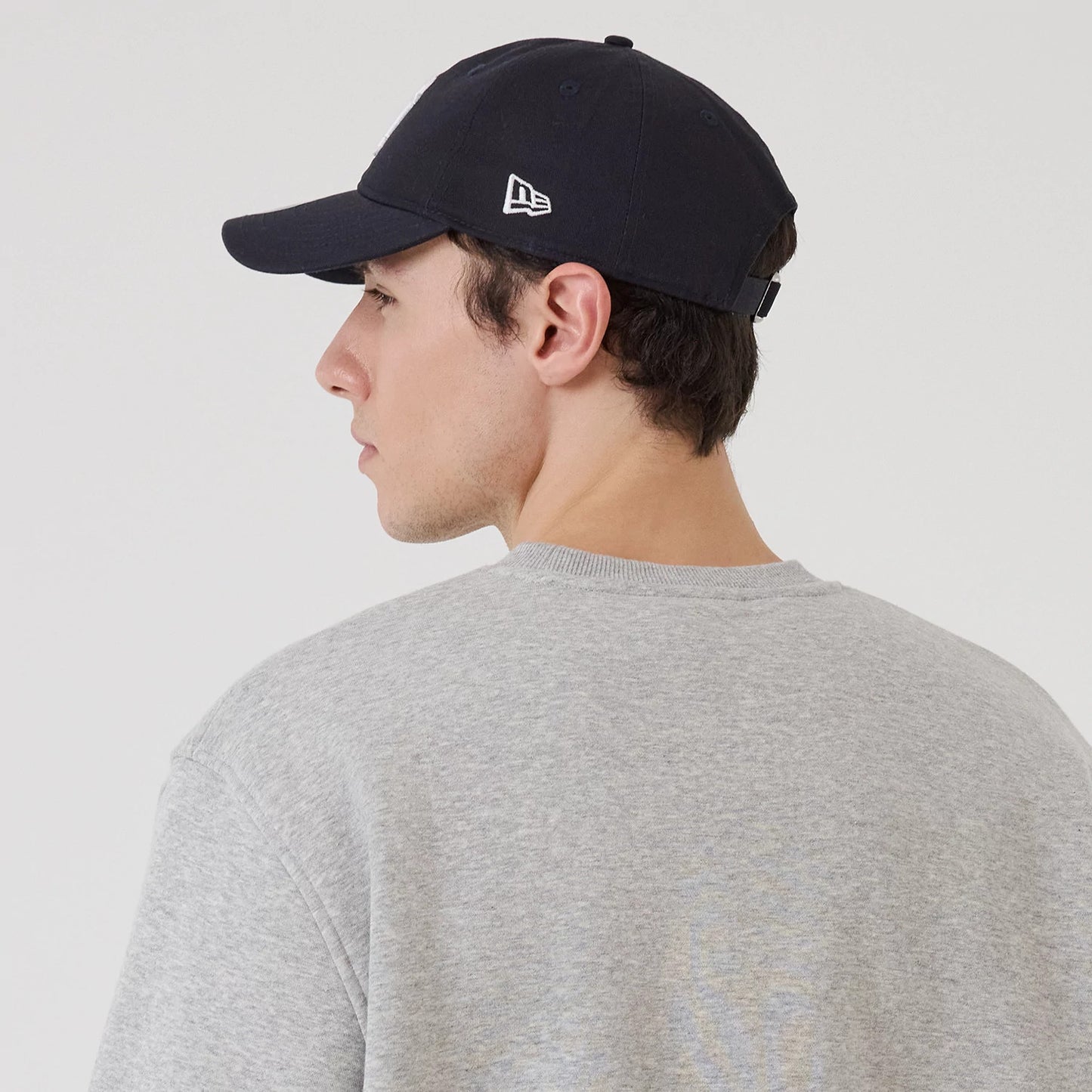 The model is wearing this MLB Sport Classic New York Yankees Crew Neck Sweater in grey. 8