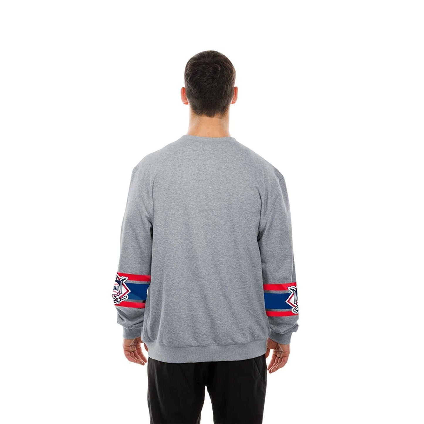 The model is wearing this MLB Sport Classic LA Dodgers Crew Neck Sweater in grey. 2
