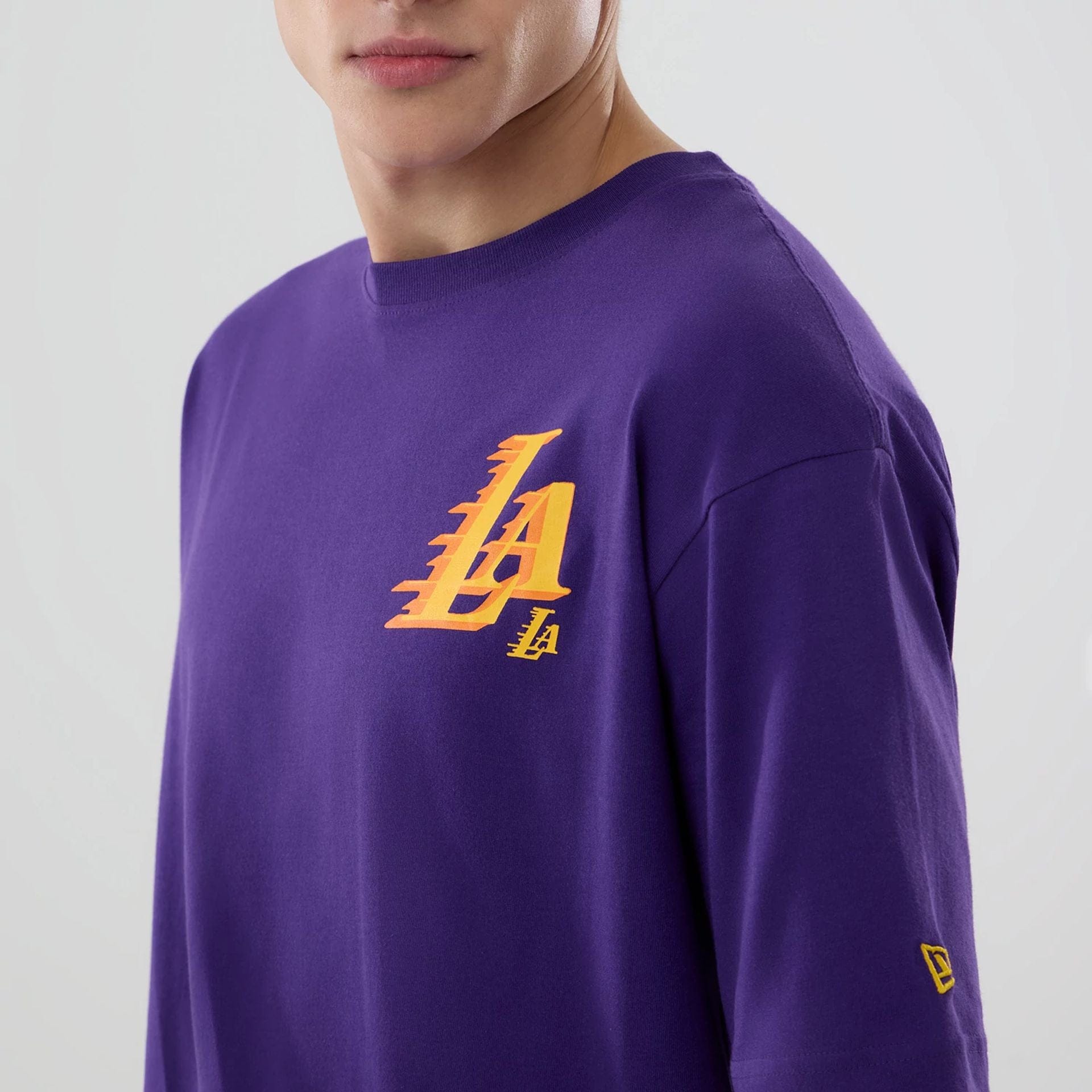 The model is wearing this NBA Graphic LA Lakers T-Shirt in purple. 5