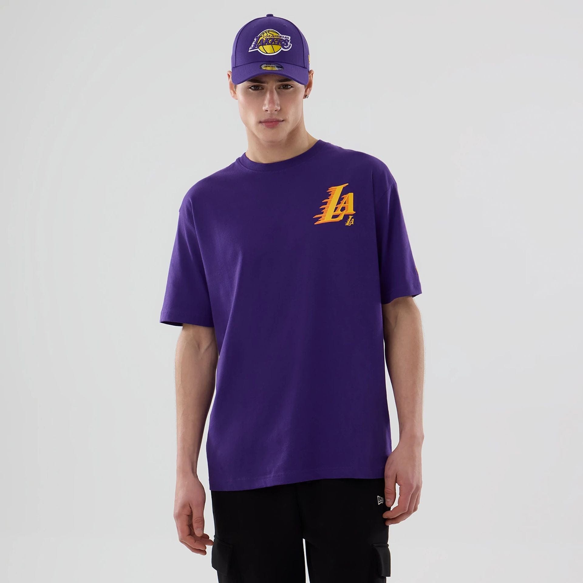 The model is wearing this NBA Graphic LA Lakers T-Shirt in purple. 1