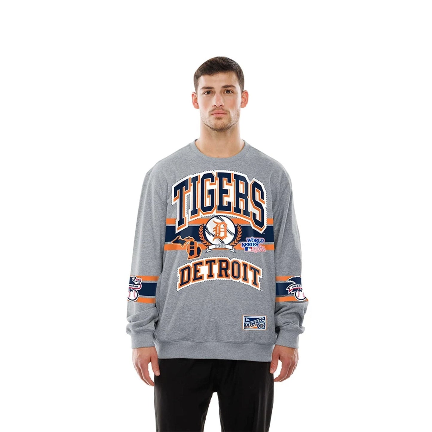 The model is wearing this MLB Sport Classic Detroit Tigers Crew Neck Sweater in grey. 1