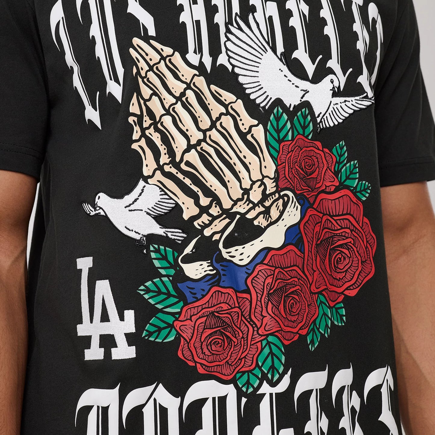 The model is wearing this MLB Script Graphic LA Dodgers T-Shirt in black. 4