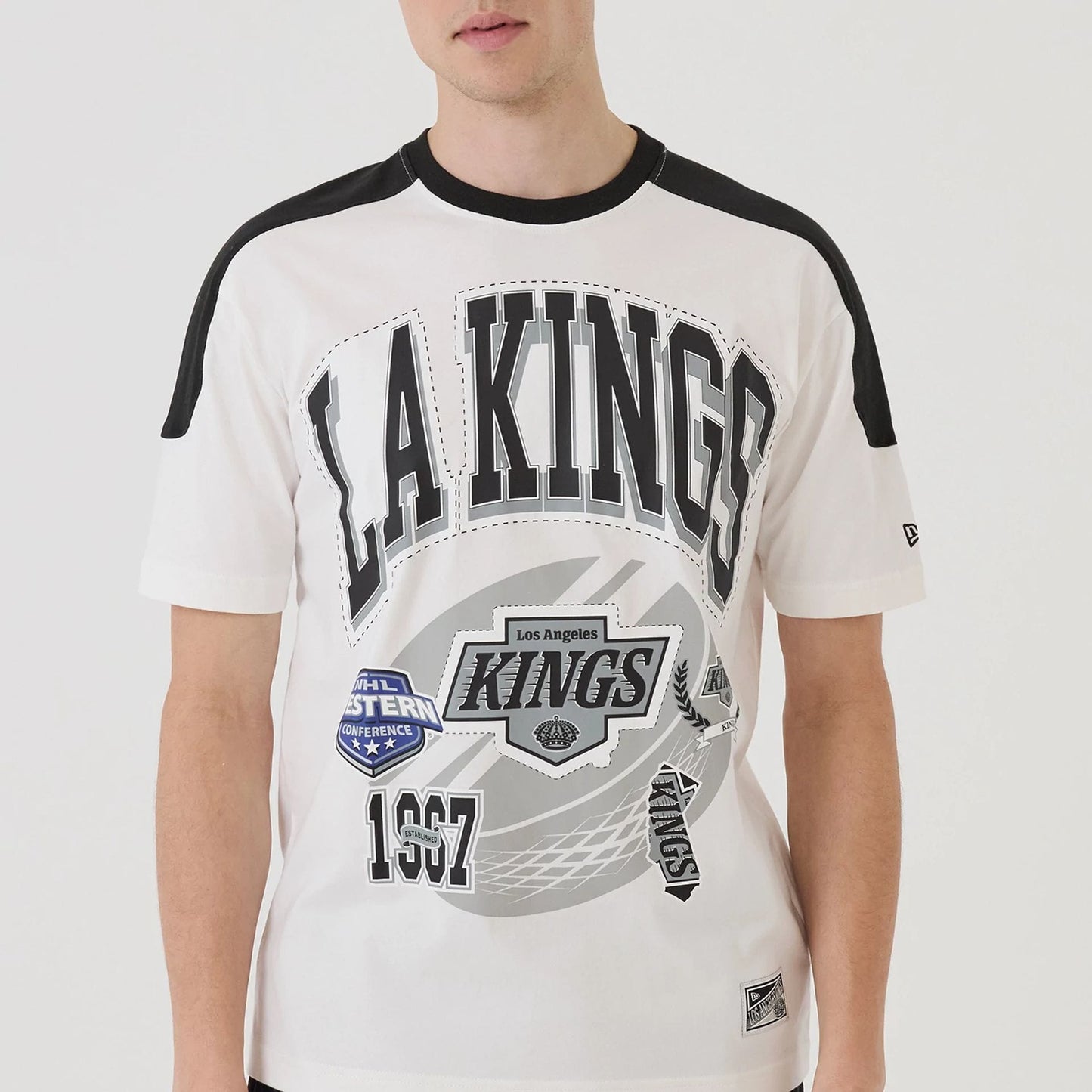 The model is wearing this NHL Sport Classic LA Kings T-Shirt in white. 5